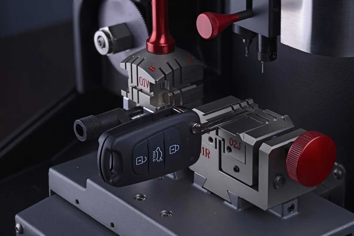 Car key being cut on a professional key cutting machine